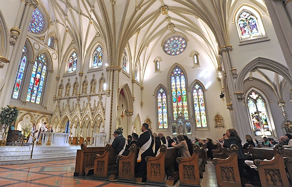 Bishop Richard J. Malone blesses the gifts during the St. Patrick's Day Mass at St. Joseph Cathedral. (Dan Cappellazzo/Staff Photographer)